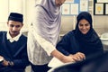 Diverse muslim children studying in classroom