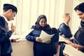 Diverse Muslim children studying in classroom