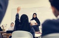 Diverse muslim children studying in classroom