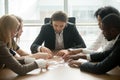 Diverse office team assembling puzzle helping finding business s Royalty Free Stock Photo