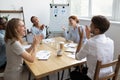 Diverse office workers team laughing and applauding at funny joke Royalty Free Stock Photo