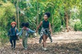 Diverse people of african american children having fun walking together in forest Royalty Free Stock Photo