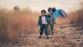 Diverse people of asian and african american children having fun walking and playing together in natural park Royalty Free Stock Photo