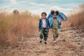 Diverse people of asian and african american children having fun walking and playing together in natural park Royalty Free Stock Photo