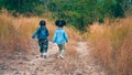 Diverse people of asian and african american children having fun walking and playing together in natural park Royalty Free Stock Photo