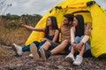 Diverse people of caucasian and asian friends having fun together traveling and camping at natural park in summer Royalty Free Stock Photo