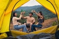 Diverse people of caucasian and asian friends having fun together traveling and camping at natural park in summer