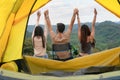 Diverse people of caucasian and asian friends having fun together traveling and camping in natural resort