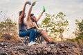 Diverse people of caucasian and asian friends having fyn together traveling in natural park in summer