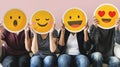 Diverse people covered with emoticons