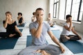 Diverse people doing Alternate Nostril Breathing exercise, practicing yoga