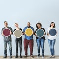 Diverse people holding blank round board Royalty Free Stock Photo
