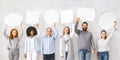 Diverse people holding empty speech bubbles above their heads, free space Royalty Free Stock Photo