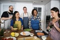 Diverse people joining cooking class