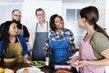 Diverse people joining cooking class Royalty Free Stock Photo