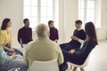 Diverse patients sitting in circle and listening to therapist in group therapy meeting Royalty Free Stock Photo