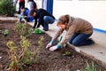 Diverse People performing Community Service gardening at local township school Royalty Free Stock Photo