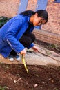 Diverse People performing Community Service gardening at local township school Royalty Free Stock Photo