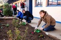 Diverse People performing Community Service gardening at local township school Royalty Free Stock Photo