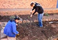 Diverse People performing Community Service gardening at local township school Royalty Free Stock Photo