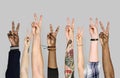 Diverse people raising their hands up