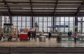 Diverse people waiting for the train on the Friedrichstrasse Railway station. Berlin. Germany.