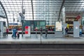 Diverse people waiting for the train on the main train station in Berlin, Germany.