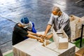 Diverse people working on an assembly line in a glue factory