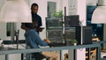Diverse programmers collaborating on coding project compiling algorithm