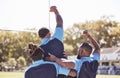 Diverse rugby teammates celebrating scoring a try or winning a match outside on a sports field. Rugby players cheering Royalty Free Stock Photo