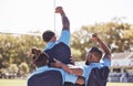 Diverse rugby teammates celebrating scoring a try or winning a match outside on a sports field. Rugby players cheering