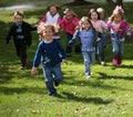 Diverse running kids Royalty Free Stock Photo