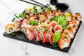 Assorted sushi platter with elegant garnishes on slate board Royalty Free Stock Photo