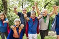 Diverse senior wearing superhero clothes having fun in the park