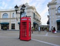 Diverse shoppers are walking on McArthurGlen Designer Outlet Streets.