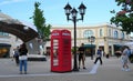 Diverse shoppers are walking on McArthurGlen Designer Outlet Streets. Royalty Free Stock Photo