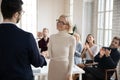 Male CEO handshake female colleague greeting with promotion