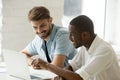 Diverse smiling businessmen having fun laughing working on lapto Royalty Free Stock Photo