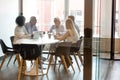 Diverse businesspeople brainstorm negotiating at office meeting Royalty Free Stock Photo