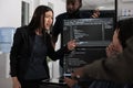 Diverse software developers analyzing html code and database Royalty Free Stock Photo