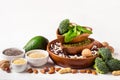 Diverse Sources of vegetable protein. Nuts, beans and broccoli on white background