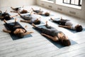 Diverse sporty people practicing yoga, relaxing in Savasana exercise Royalty Free Stock Photo