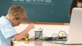 Diverse student working together to fix main board at stem class. Pedagogy. Royalty Free Stock Photo