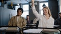 Diverse students classmates attentively listening to interesting lecture enthusiasm in classroom young caucasian girl Royalty Free Stock Photo