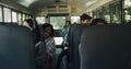 Diverse students sitting schoolbus together. Multiracial teenagers going home. Royalty Free Stock Photo