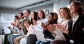 Diverse Team of Businesspeople Applauding During Corporate Training Royalty Free Stock Photo