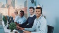 Diverse team of call center customers looking to the camera and smiling Royalty Free Stock Photo