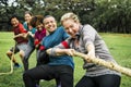 Diverse team competing in tug of war Royalty Free Stock Photo