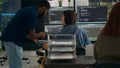 Diverse team of data programers analyzing code programming on laptop Royalty Free Stock Photo