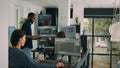 Diverse team of database developers analyzing code on terminal window Royalty Free Stock Photo